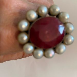 Brilliant polished red stone(coral) surrounded by water pearls and set in silver
